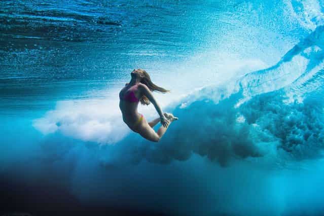 Female Surfers Beneath the Waves