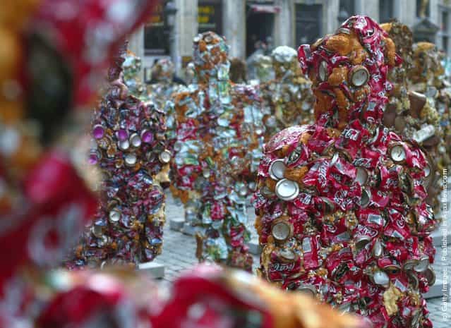 German artist Ha Schult unveils his latest exhibit Trash Peoples, a huge sculpture made of recycleble rubbish which will remain in place for 5 days at Brussels' Grand Place, on April 1, 2005 in Brussels, Belgium