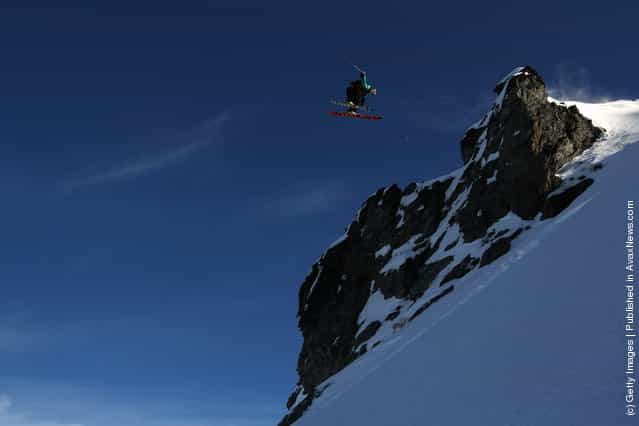 Freeskier Chris Booth of Australia launches off a drop during the World Heli Challenge freestyle day in backcountry at Minaret Station on July 31, 2011 in Wanaka, New Zealand