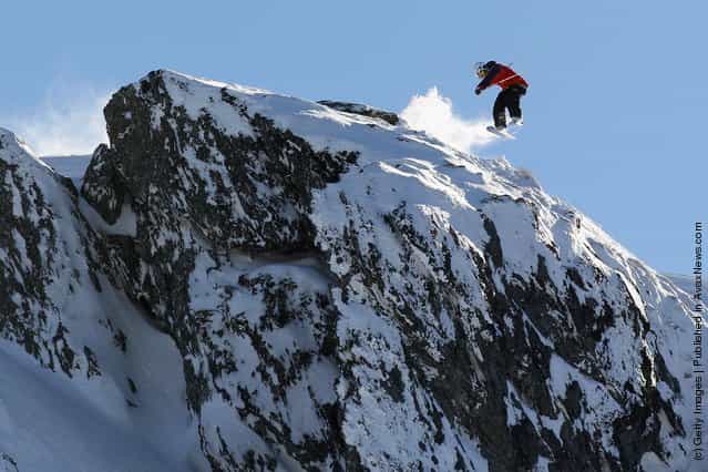 Freeskier Boen Ferguson launches off a drop during the World Heli Challenge freestyle day in backcountry at Minaret Station on July 31, 2011 in Wanaka, New Zealand