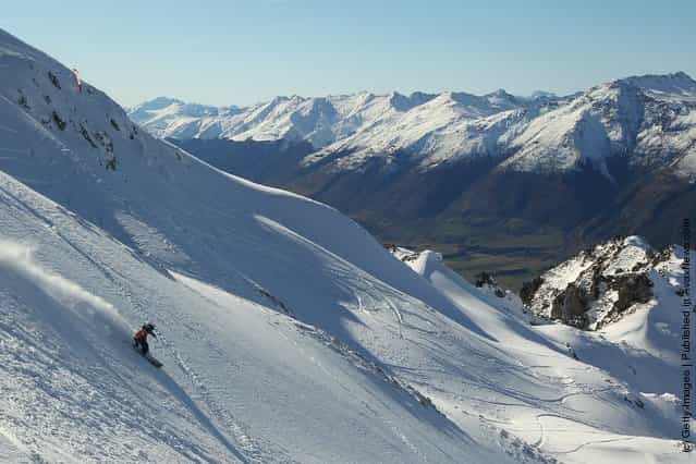 Freeskier Mitch Reeves of Australia carves a turn during the World Heli Challenge freestyle day in backcountry at Minaret Station on July 31, 2011 in Wanaka, New Zealand