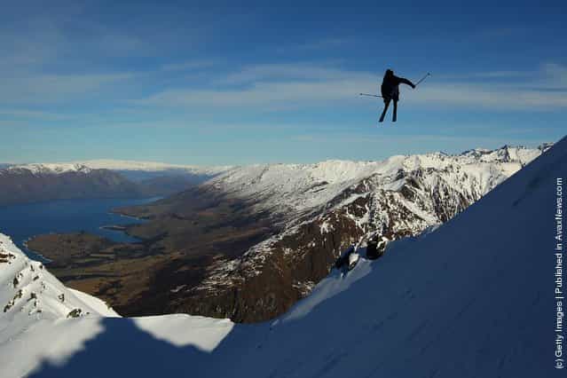 Freeskier Charlie Timmins of Australia launches off a drop during the World Heli Challenge freestyle day in backcountry at Minaret Station on July 31, 2011 in Wanaka, New Zealand