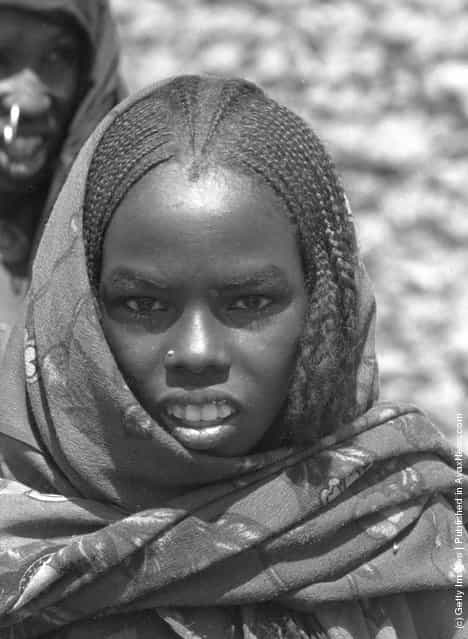 circa 1950: A child wearing a traditional headscarf in Seguedine, Niger