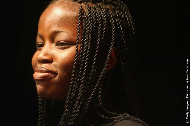 A Nigerian fashion model smiles during a rehearsal for a fashion show to promote ethnic fashion June 13, 2006 in Tel Aviv, Israel