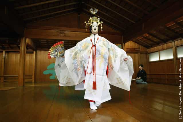 A traditional Japanese Noh actor gets his masks and costumes put on prior to demostrating a performance of the ancient theatrical art