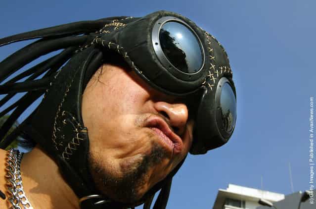 A male fashion model shows off his Oakley helmet at the Bangkok Fashion City Extravaganza