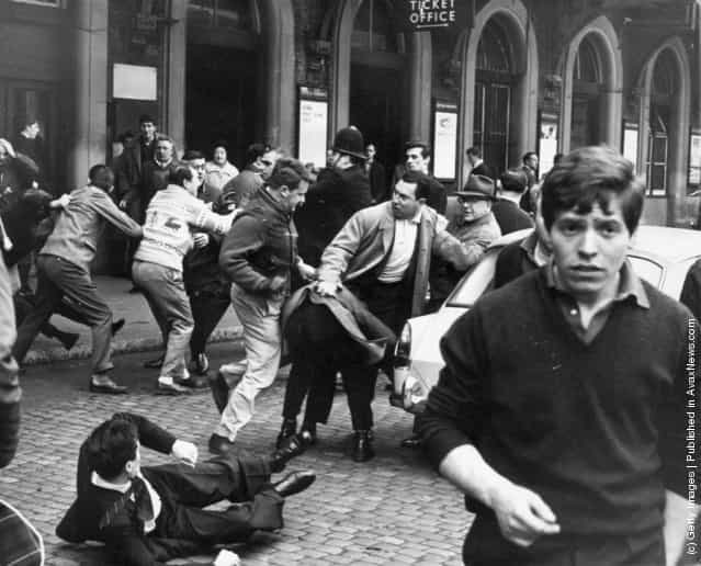 A fight breaks out between anti-Fascists and supporters of Oswald Mosleys Union Movement in the forecourt of Charing Cross Station in London, 12th May 1963