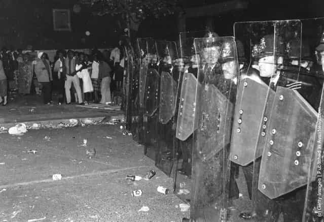 Police with riot shields during the Notting Hill Carnival, 1979