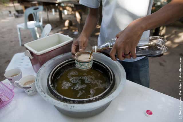 Thai Malay Muslim user mixes coke into 4 x 100, the popular cheap narcotic drink
