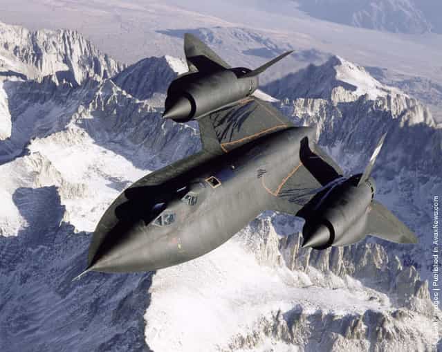 SR-71B Blackbird aerial reconnaissance aircraft photographed over snow capped mountains in 1995