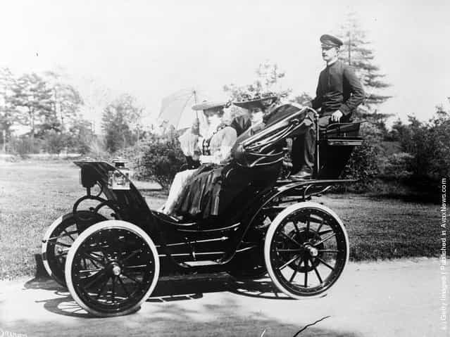 Two Victorian ladies out for a drive with their chauffeur