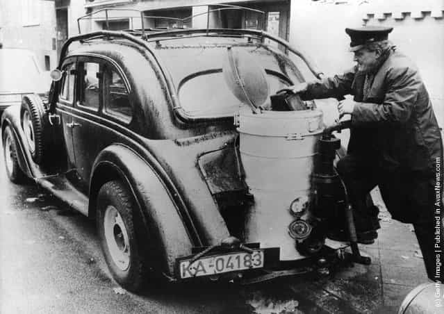 An Adler Diplomat car, built in Germany in 1936, with its carburettor that uses wood instead of petrol, fitted during World War II
