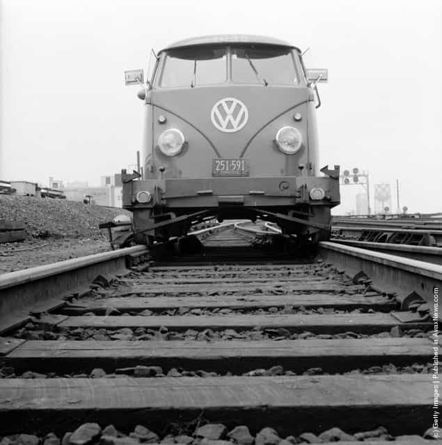 1956: Volkswagen travelling along the tracks of the Long Island railroad