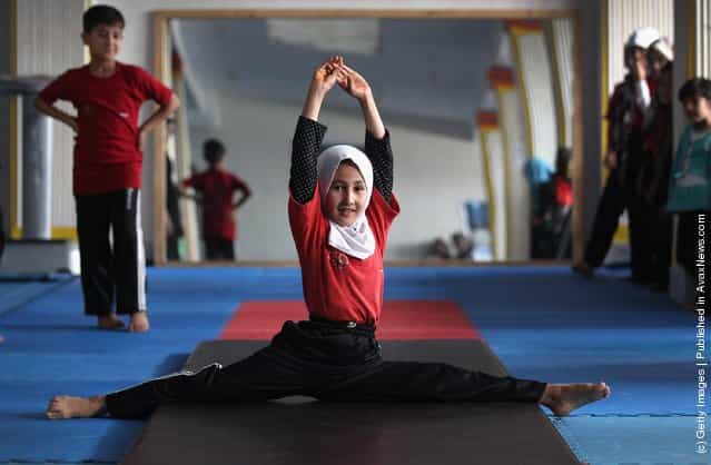 Afghan girls practice during gymnastics class at a U.S. funded gymnasium for women