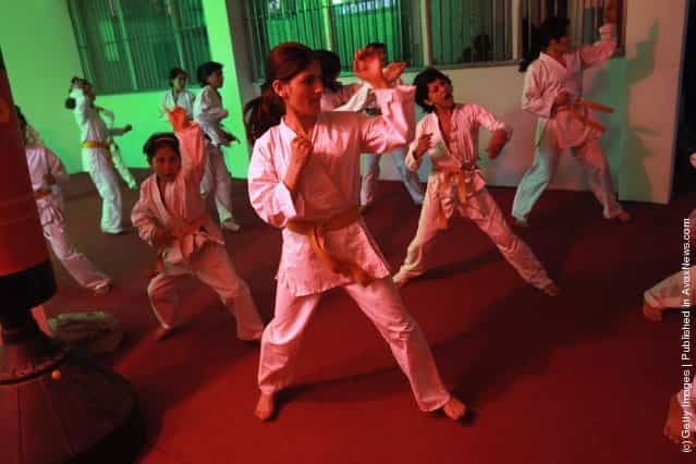 Afghan orphans practice during karate class at the Mehan Orphanage