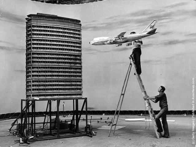 Film technicians at Pinewood Studios set up a miniature air crash sequence for the Jack Gold film The Medusa Touch, using scale models of a Boeing 747 and a skyscraper