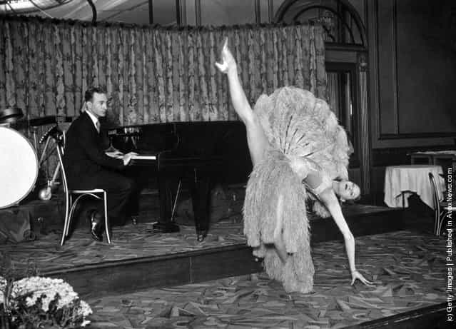 Pianist Jack Harris and dancer Vera run through a dress-rehearsal of a fan dance for the Dressmakers Charity Ball