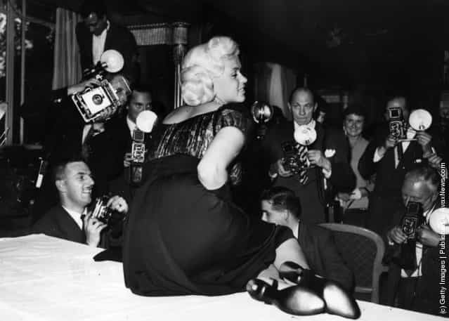 American film star, Jayne Mansfield, posing for photographers at the Dorchester Hotel, London, 1957
