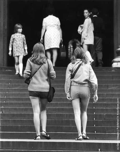 Female visitors in hot pants entering St Pauls Cathedral, London, 1971