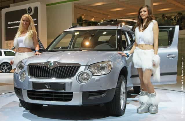 Models present a Yeti compact SUV at the stand of Czech automaker Skoda at the AMI 2009 International Auto Fair