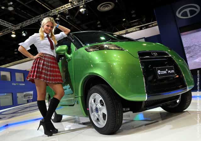 Model Amanda Kaspor of Highland, Michigan poses with the CT&T e-Zone Plus electric car