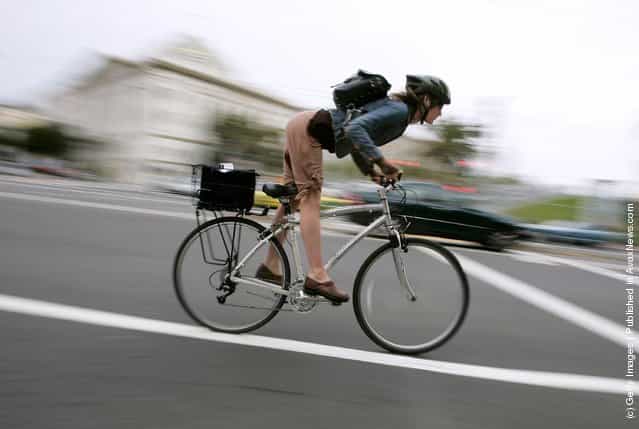 A bicyclist commutes along Market Street