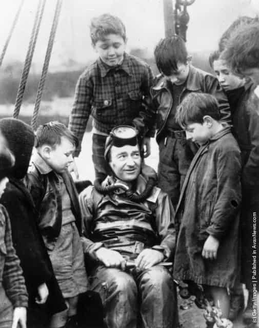 1950: Naval expert and frogman, Lionel Buster Crabb, relating some of his experiences to an attentive audience of schoolchildren in Tobermory