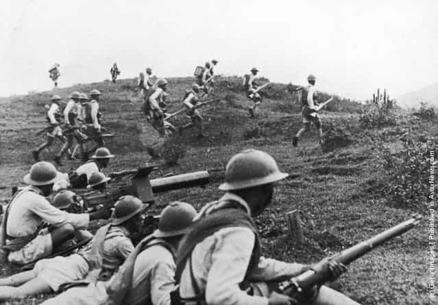 The Kwantung army (Chinese) rushing to the front lines, five miles south-east of Waichon. The Japanese occupied the town on 15th October 1938