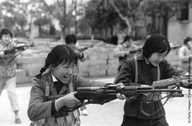 1973: In Maoist China, Shanghai girls are taught how to kill with bayonetted rifles, demonstrated here in an exercise drill