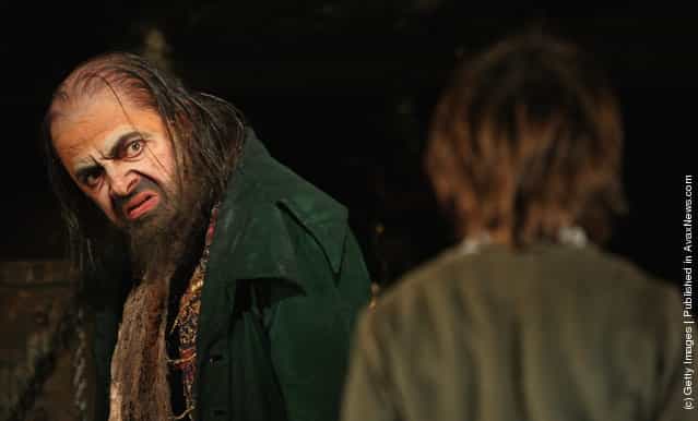 Rowan Atkinson (L) performs in the role of Fagin during a rehearsal of Lionel Bart's musical adaptation of Oliver
