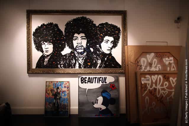 Works by artist Mr Brainwash are readied for exhibiting at the Opera Gallery