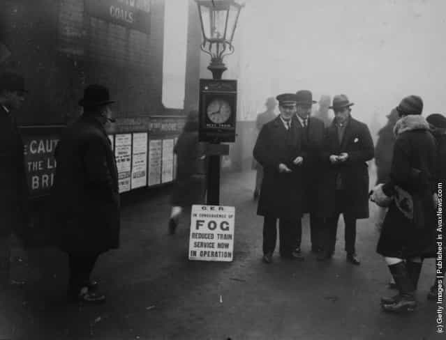 1927: A scene at Woodford, where city workers were informed that fog may delay their journeys to work