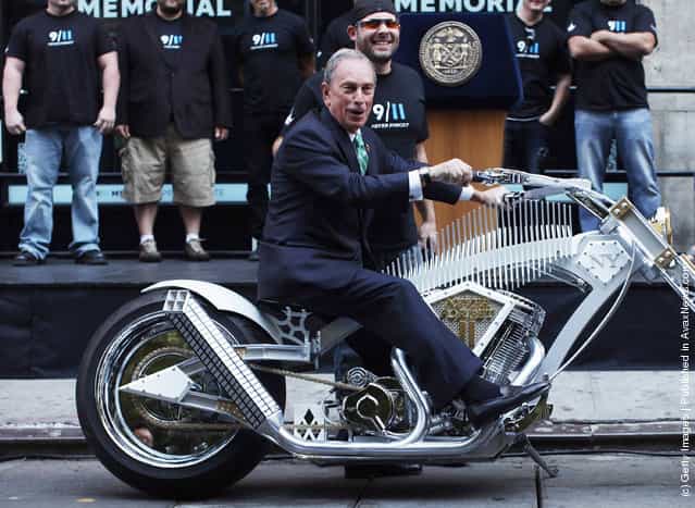 New York City Mayor Michael Bloomberg sits a custom made World Trade Center inspired motorcycle in front of the 9/11 Memorial Preview Site
