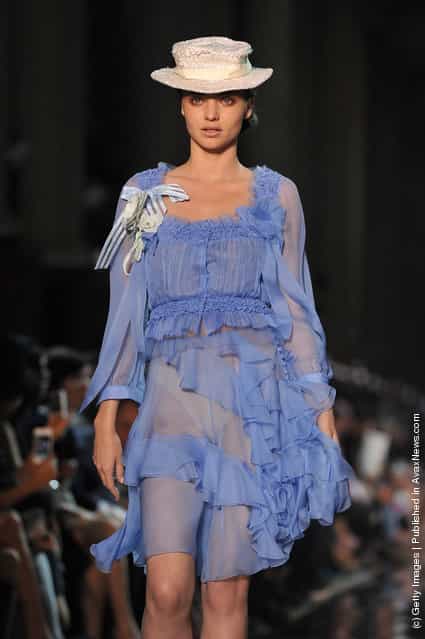 A model walks the runway during the John Galliano Ready to Wear Spring / Summer 2012 show during Paris Fashion Week