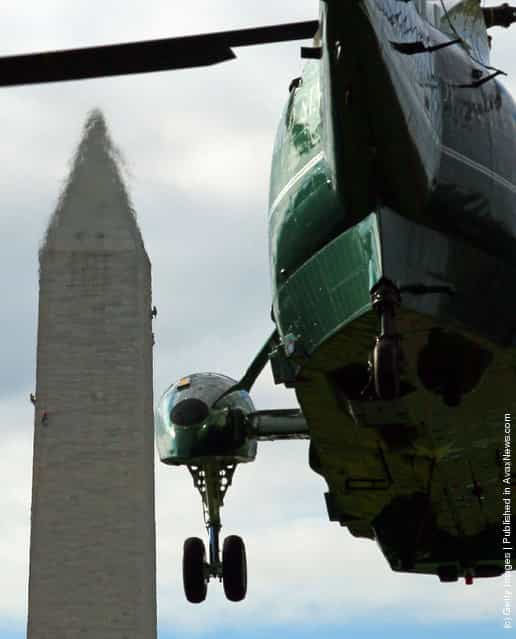 U.S. President Barack Obama walks toward Marine One while departing the White House
