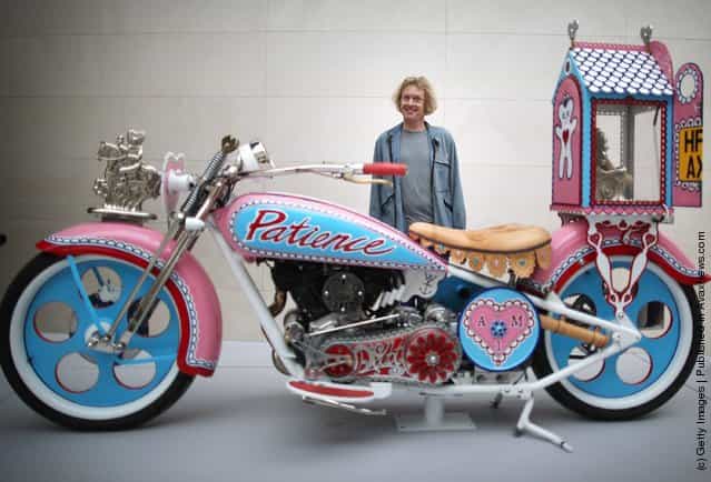 Grayson Perry stands with his 'Kenilworth AM1' customised motorbike