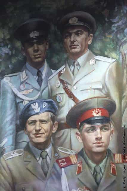 A painting detail shows soldiers wearing uniforms of Cold War-era Warsaw Pact-member