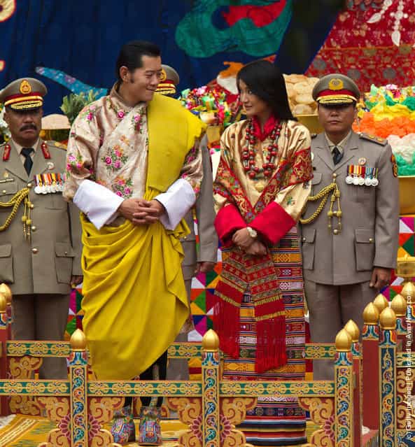 His majesty King Jigme Khesar Namgyel Wangchuck (L), 31, smiles at his bride during the purification marriage ceremony to Queen Jetsun Pema