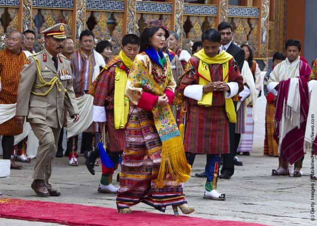 Queen Ashi Jetsun Pema, 21, walks out after the marriage ceremony is completed in Punakha, Bhutan