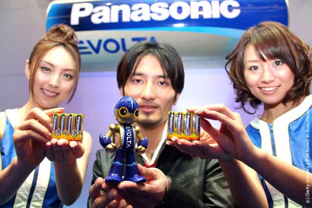 Creator of the EVOLTA robot, Tomotaka Takahashi (C) introduces Panasonics new alkaline battery EVOLTA series at Tokyo Midtown on January 15, 2008 in Tokyo, Japan. The new AA alkaline battery sets a Guinness World Record for the longest service life