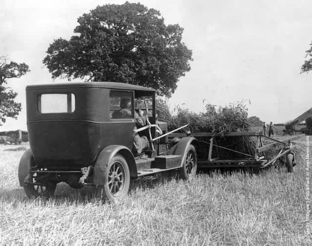 1937: An old car is used to harvest a field at Sprowston, Norfolk