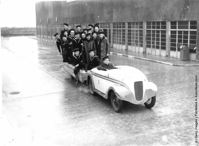 1940: Navy recruits riding in car and trailer at the HMS Royal Arthur training centre formerly Butlins holiday camp, Skegness
