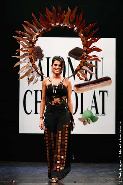 Karine Ferri displays a chocolate decorated dress during the Chocolate dress fashion show