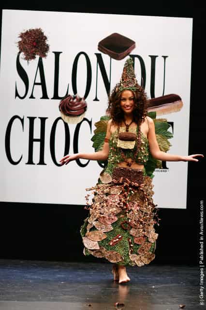 Anne-Laure Girbal displays a chocolate decorated dress during the Chocolate dress fashion show