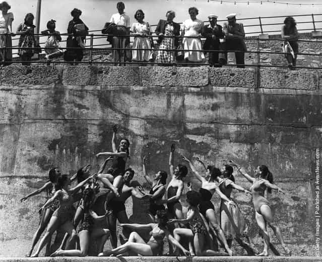 Members of the London Theatre Ballet Company form a frieze-like tableau on the beach at Eastbourne, 1951