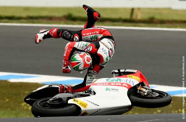 Roberto Locatelli of Italy and the Metis Gilera Team crashes during the 250cc race at the Australian MotoGP, which is round 15 of the MotoGP World Championship, at Phillip Island Grand Prix Circuit