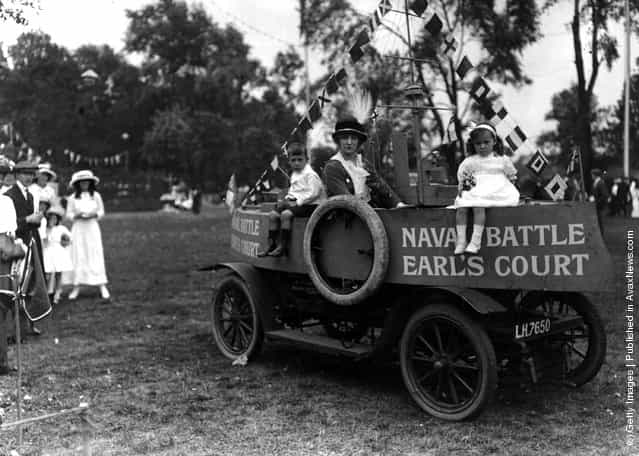 1913: Countess Maschgo in a car converted into a model cruiser with some children at the Childrens Fete and Gala, Taggs Island