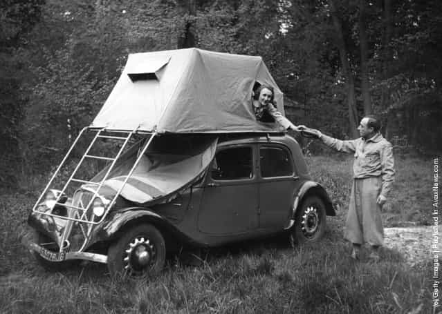 1950: A tent that balances very neatly on top a car
