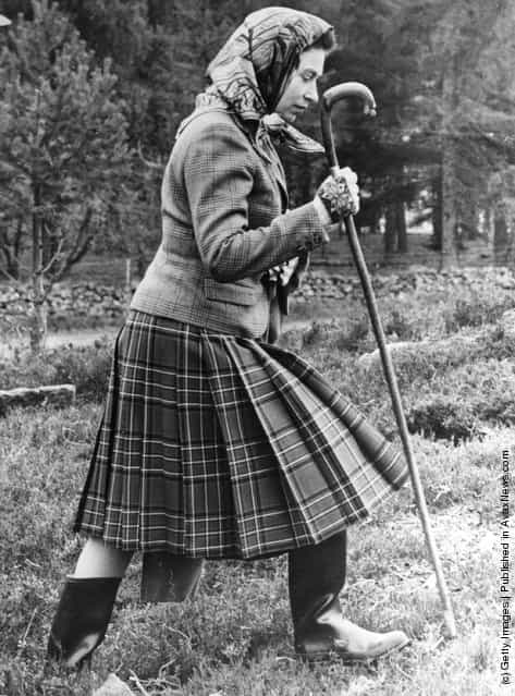 1967: Queen Elizabeth II walking cross country at the North of Scotland Gun Dog Association Open Stake Retreiver Trials in the grounds of Balmoral Castle