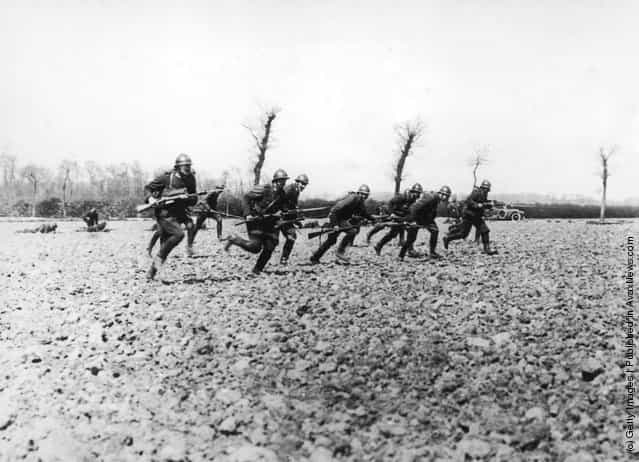 Belgian soldiers make a charge near the River Yser during World War I, circa 1914